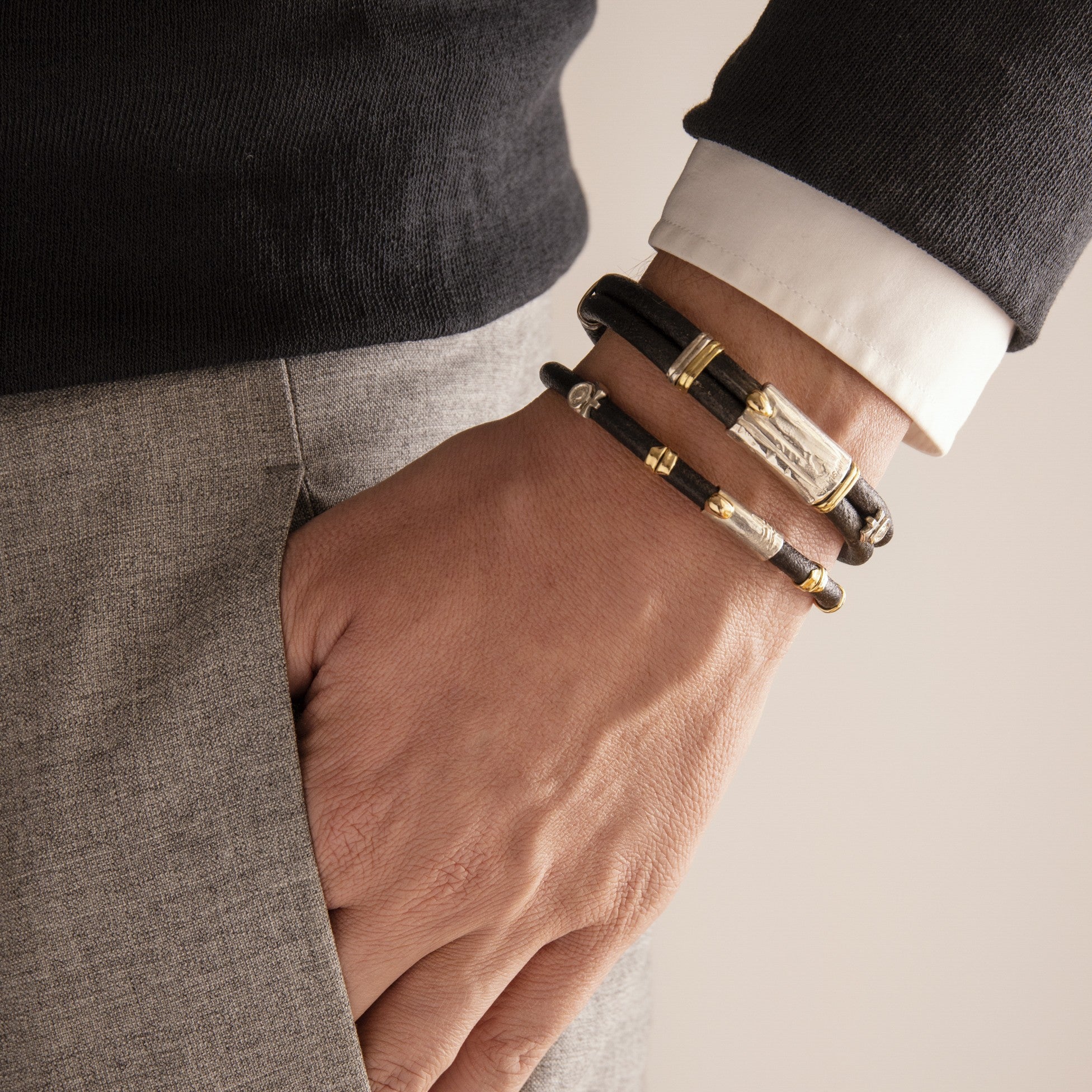 Leather bracelet with silver and gold elements