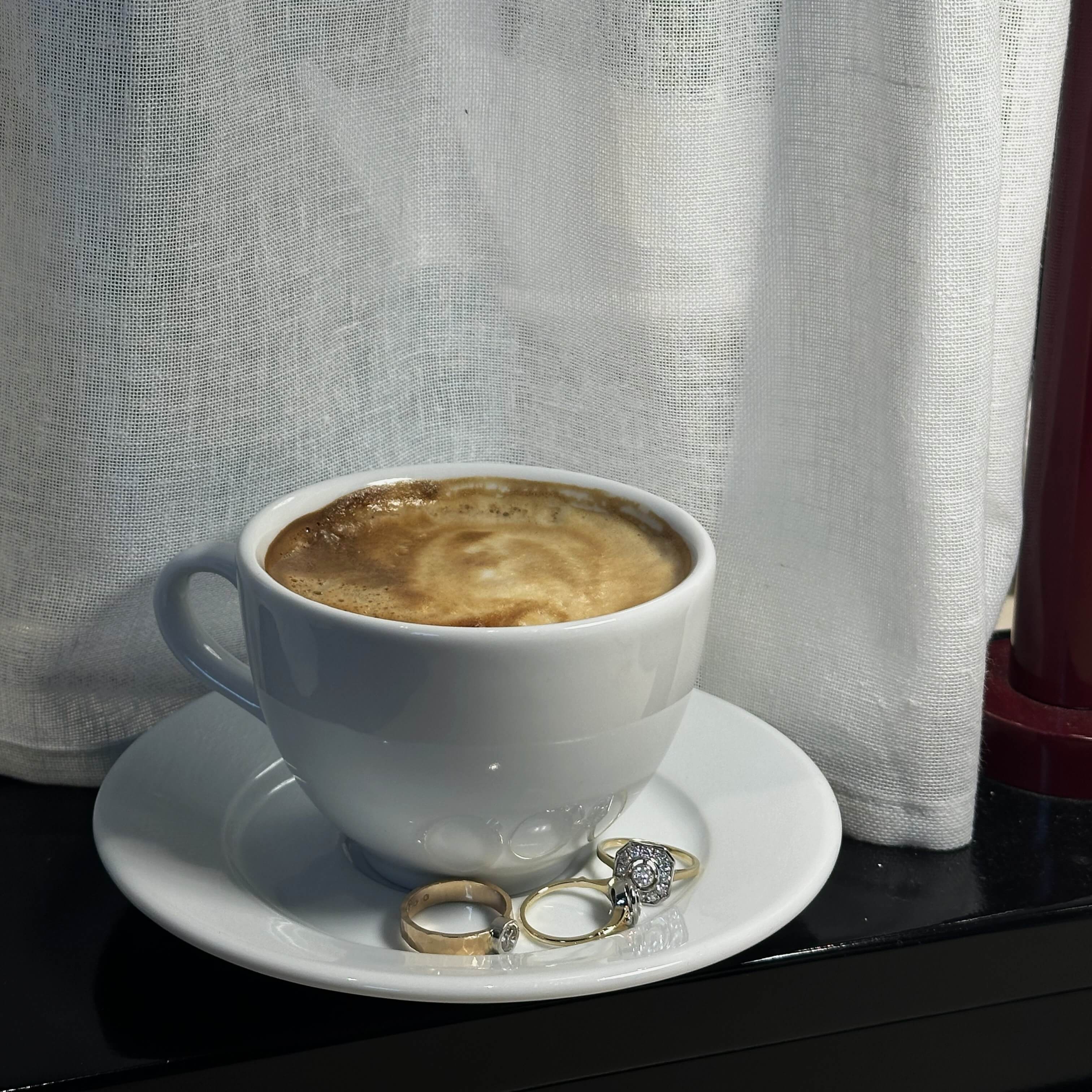Gold ring with a diamond and a hammered, wide band