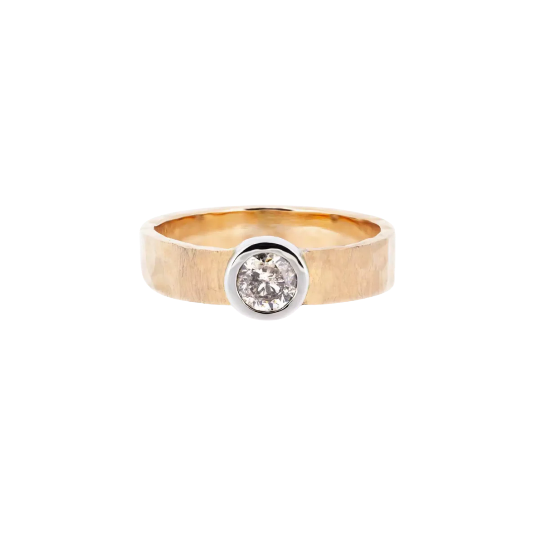 Gold ring with a diamond and a hammered, wide band
