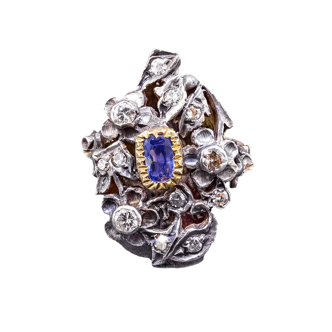 Gold ring with diamonds and a sapphire in the Art Nouveau style