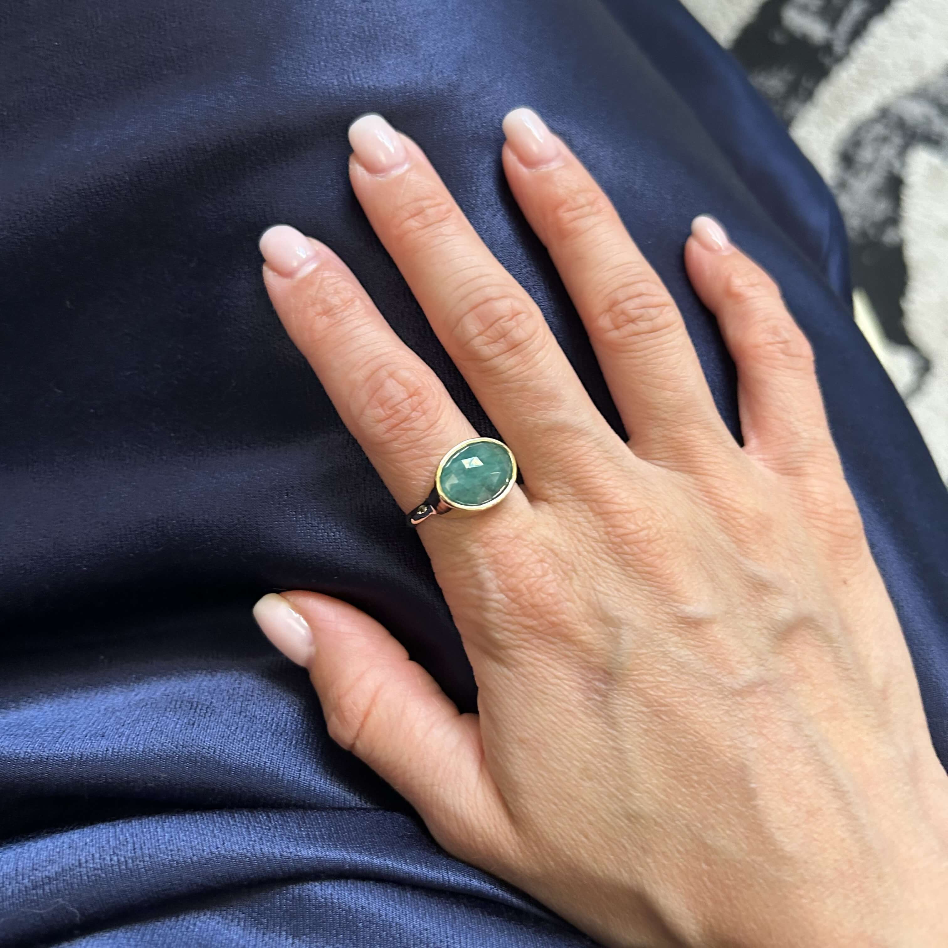 Gold ring with faceted emerald