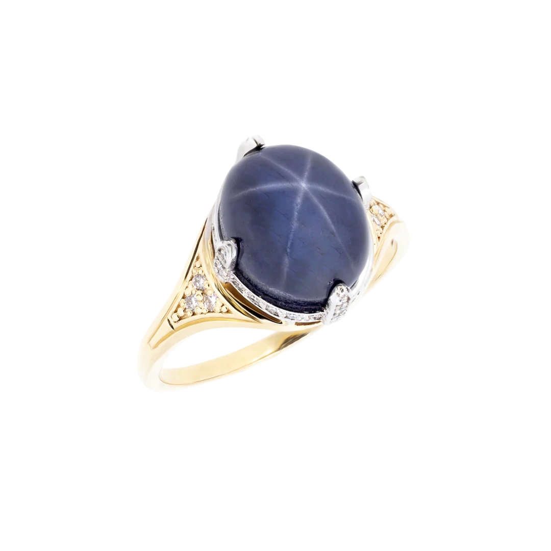 Gold ring with natural star sapphire and diamonds