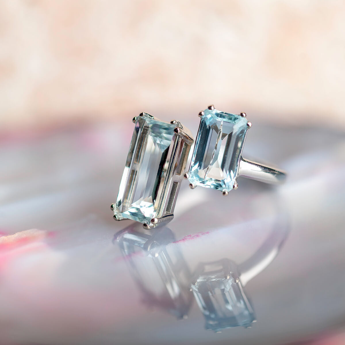 Gold ring with aquamarines in an open composition