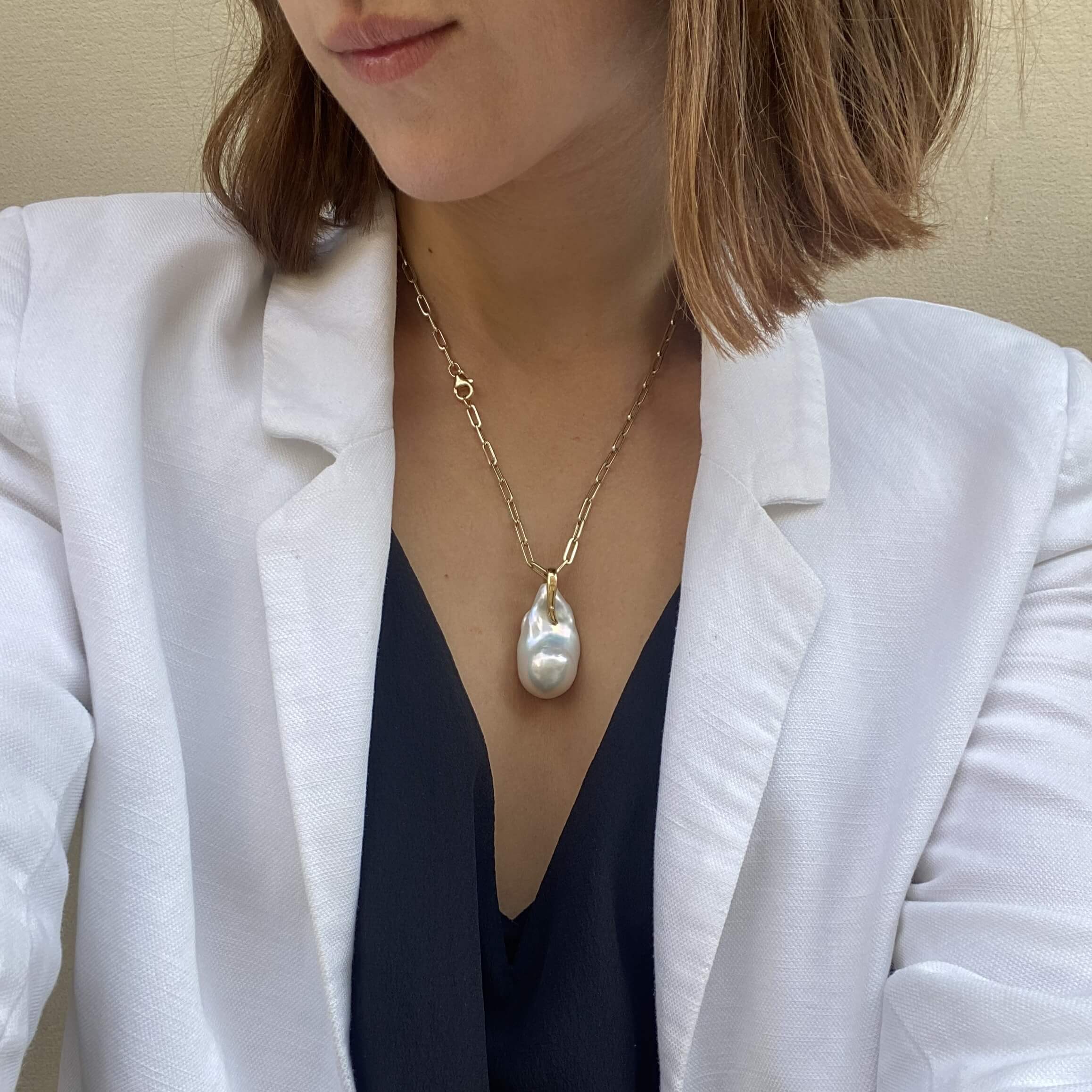 Gold Seafood pendant with a large comet pearl