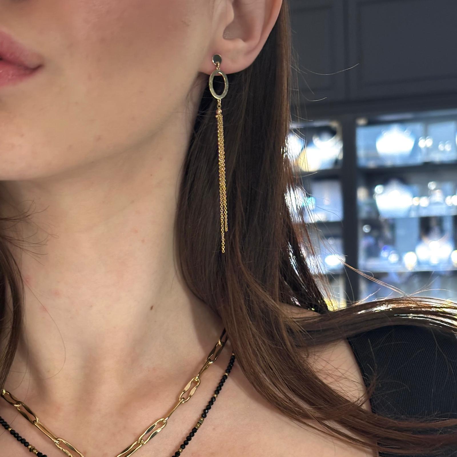 Gold dangling long earrings