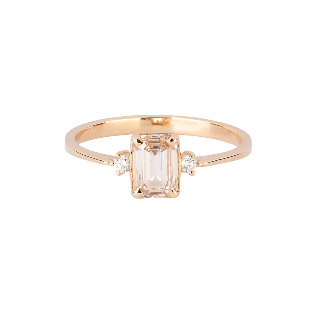 Gold engagement ring with a 1 ct emerald cut diamond