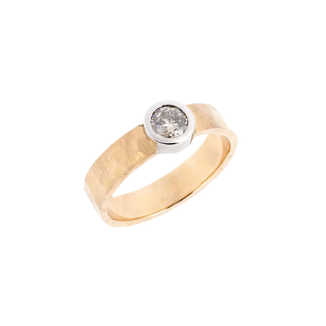 Gold ring with a diamond and a hammered, wide band