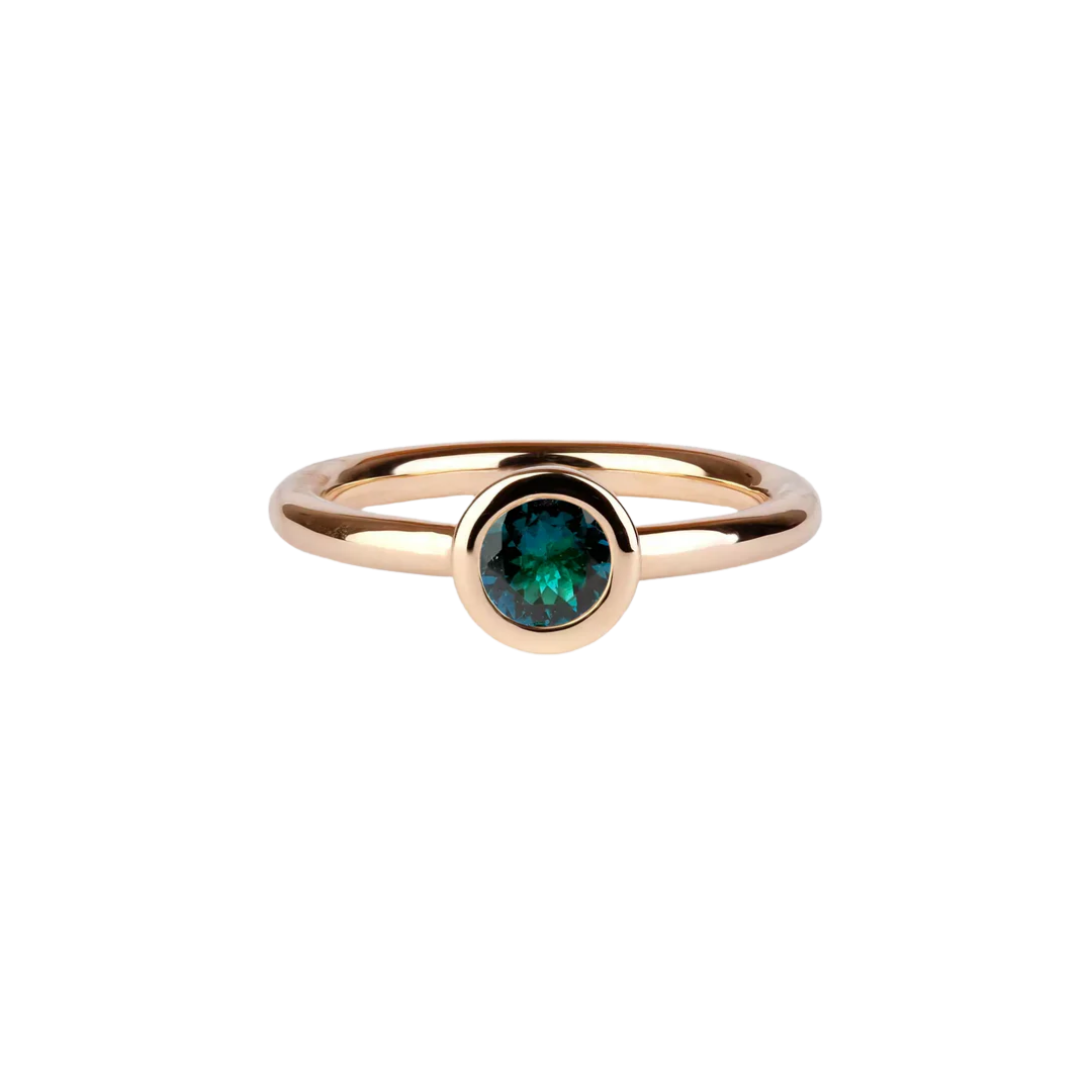 Gold ring with indigo tourmaline in a bezel setting